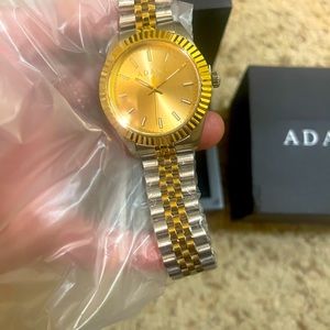 Adane watch with new tags and bracelet.